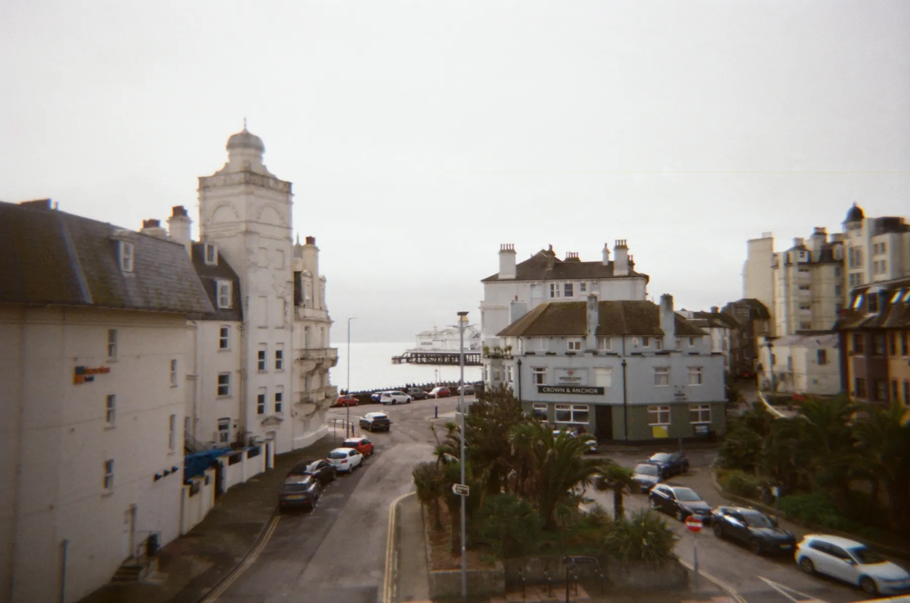 Coastal town street opening towards the sea