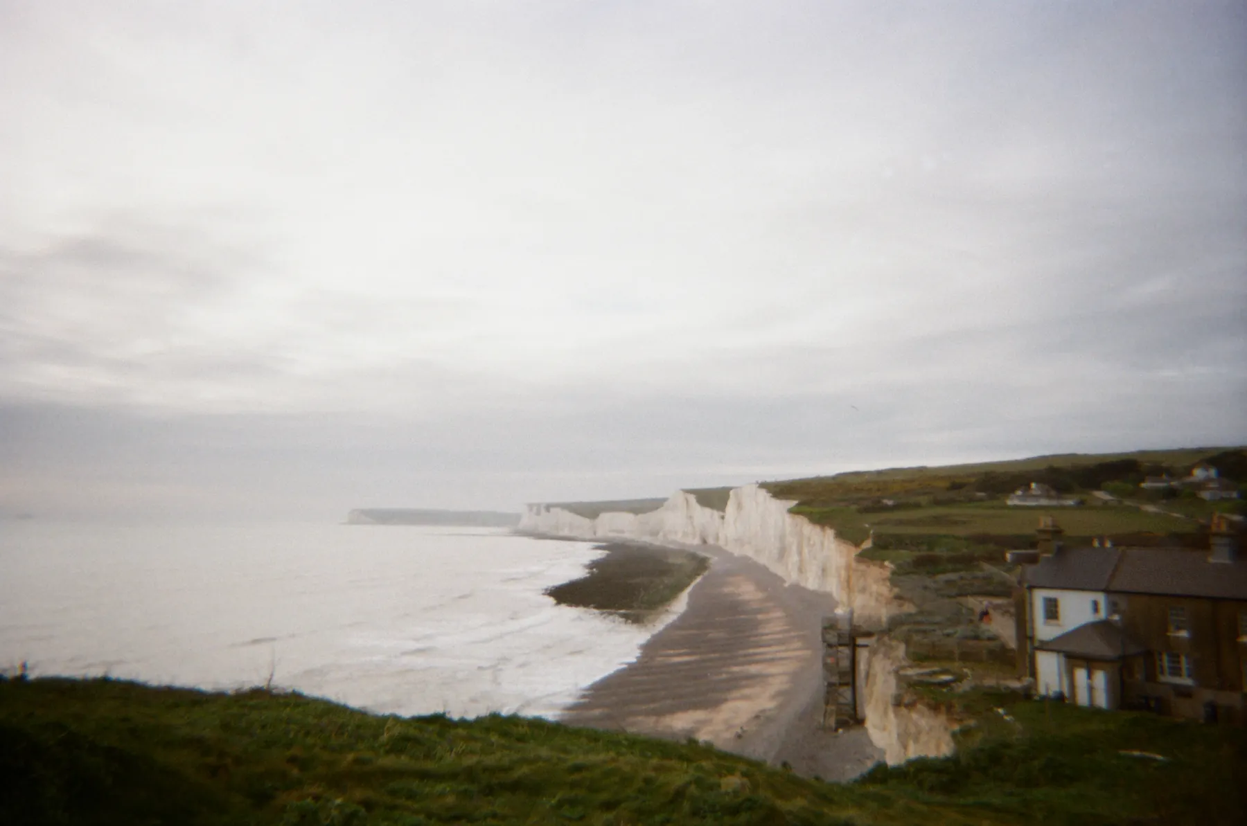 White cliffs curving around a quiet beach